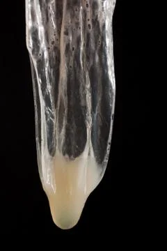 Used condom with sperm Stock Photos