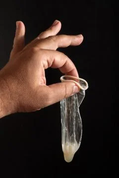 Used condom with sperm Stock Photos
