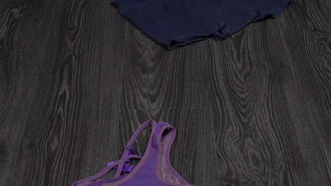 A used condom is thrown onto the floor. A condom and underpants are lying on the Видео 116570588