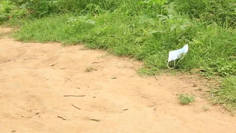 Used Covid Mask on the Ground Video stock 152183219