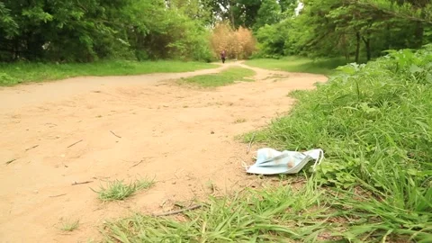 Used Covid Mask on the Ground Video stock 152183239