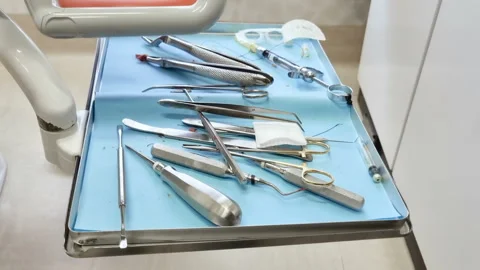 Used Dentist instruments after a cavity sick dental extraction, working tools Stock Footage 241280970