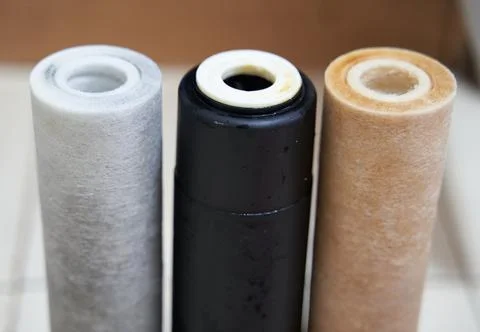 Used dirty replaceable filter cartridges for drinking water purification. Wat Stock Photos