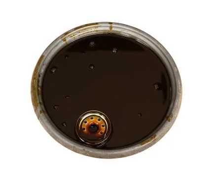 Used engine oil in basin Stock Photos