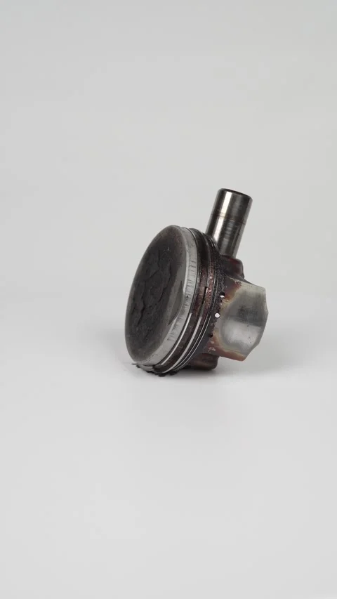 Used engine piston head with carbon deposits isolated on white background, .. Stock Footage 317524596