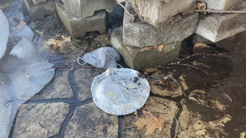 Used Facemask on the Ground - Litter - Garbage Stock Footage 149706585