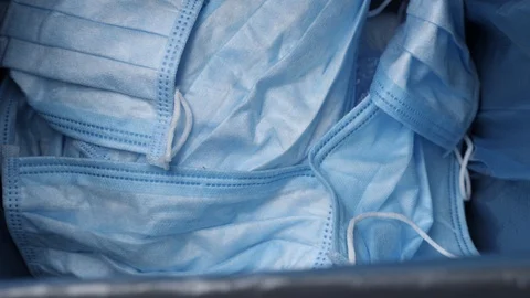 Used hygienic mask in the trash bin, infectious waste, prevented virus covid-19 Video stock 130152811
