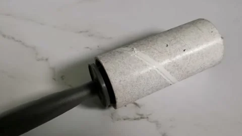 Used Lint Roller on White Background Stock Footage 205827880