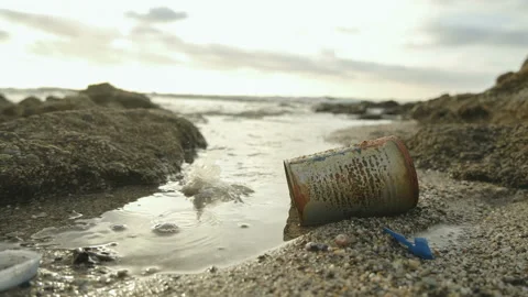 Used metal box and microplastic discarded on sea ecosystem,environment pollution Video stock 220462191