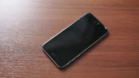 Used modern smartphone, cracks on the screen, gadget repair required Stock Footage 118579533