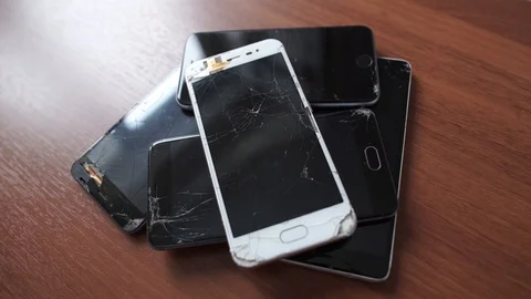 Used modern smartphone, cracks on the screen, gadget repair required Stock Footage 118579584