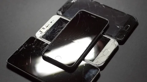 Used modern smartphone, cracks on the screen, gadget repair required Stock Footage 118580111