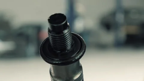 Used oil sump plug Stock Footage 138633098