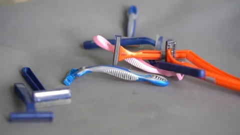 Used old dirty plastic disposable razors. Plastic pollution problem Stock Footage 123824066