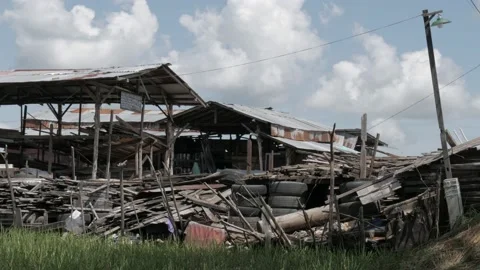 Used old wood store alongside the highway in Banjarmasin Stock Footage 132123232