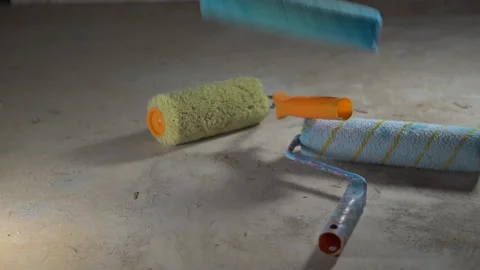 Used paint rollers in different colors. Slow fall. Consumables for repairs 库存影片 218367862