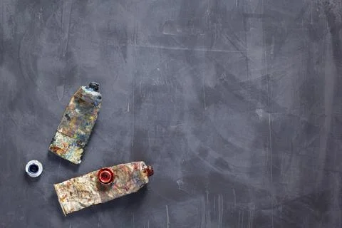 Used paint tubes as painter tools at table background texture. Art painter co Stock Photos