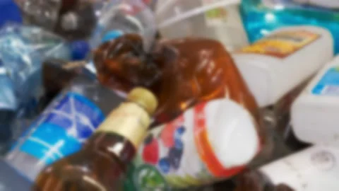 Used plastic bottles of various colors and sizes transporting on a conveyor for Stock Footage 151069558