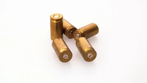 Used rustic 9mm pistol bullet shell casing rounds on a white background, Stock Footage 117714911