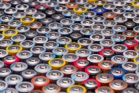 Used in several rows arranged AAA batteries of different colors and manufactu Stock Photos