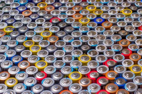 Used in several rows arranged AAA batteries of different colors and manufactu Foto stock