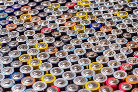 Used in several rows arranged AAA batteries of different colors and manufactu Stock Photos