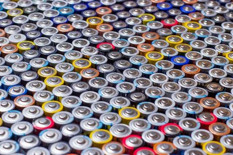 Used in several rows arranged AAA batteries of different colors and manufactu Stock Photos