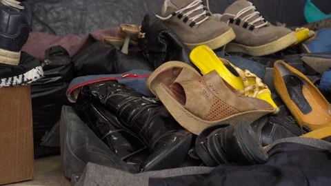 Used shoes and clothes waste Stock Video Pond5