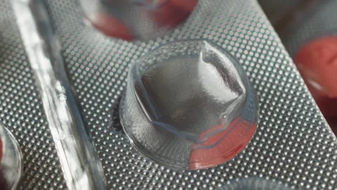 Used Sitagliptin pill blister pack macro close up presentation slowly rotat.. Stock Footage 344706334
