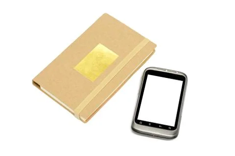 Used smartphone with note book Stock Photos