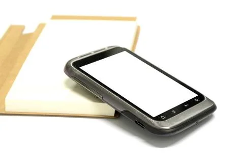 Used smartphone with note book Stock Photos