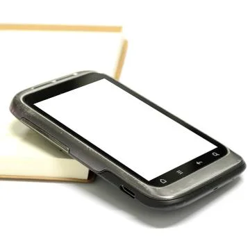 Used smartphone with note book Stock Photos