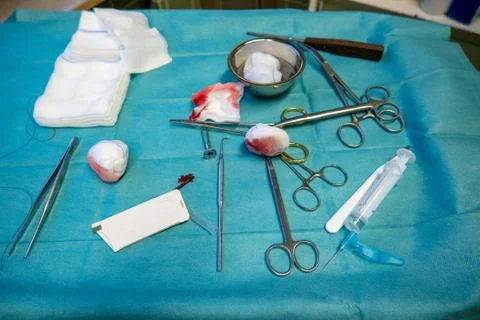 The used sterile instruments are on an operating table after screw removal Stock Photos