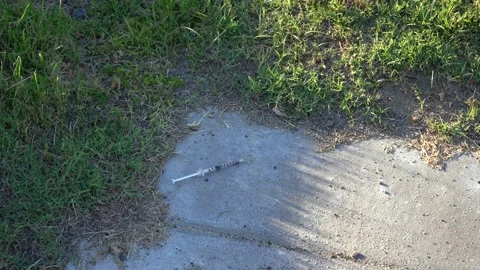 Used Syringe on the Ground 動画素材 221668582