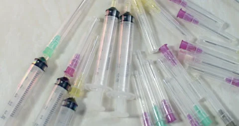 Used syringes are ready to be discarded.Used syringes must be thrown away. Stock Footage 286312772