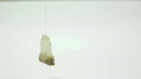 Used tea bag on white background Stock Footage 151864265