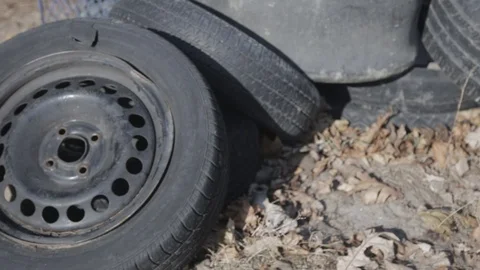 Used tire stacks in Workshop vulcanization yard - Close Up Shot Stockbeeldmateriaal 125024806