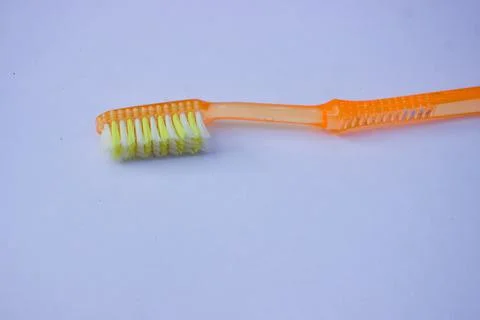 Used toothbrush on gray background Stock Photos