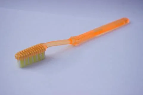 Used toothbrush on gray background Stock Photos
