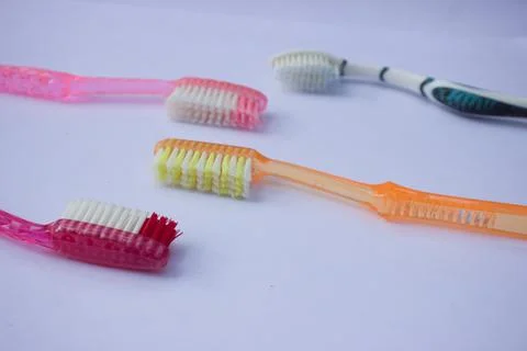 Used toothbrush on gray background Stock Photos
