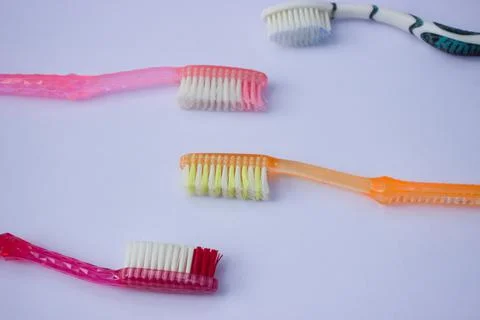 Used toothbrush on gray background Stock Photos