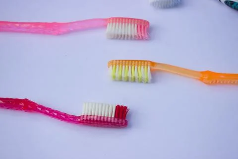 Used toothbrush on gray background Stock Photos