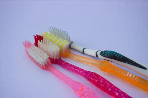 Used toothbrush on gray background Stock Photos