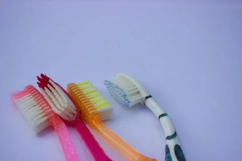 Used toothbrush on gray background Stock Photos
