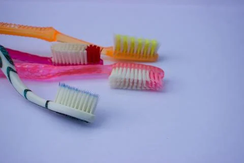 Used toothbrush on gray background Stock Photos