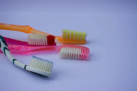 Used toothbrush on gray background Stock Photos