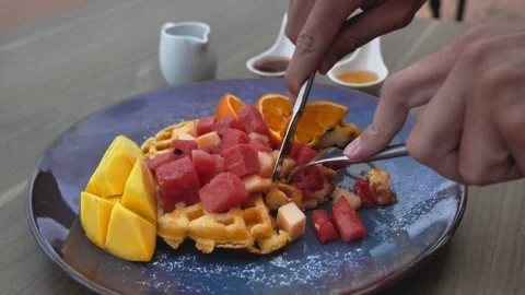 Useful breakfast. Sliced Belgian waffles with fruit Stock Footage 171471389