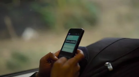 Useing smartphone, while travelling on a fast train Stock Footage 61114137