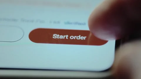 User about to tap the button Start order within an ecommerce application. E Stock Footage 327899502