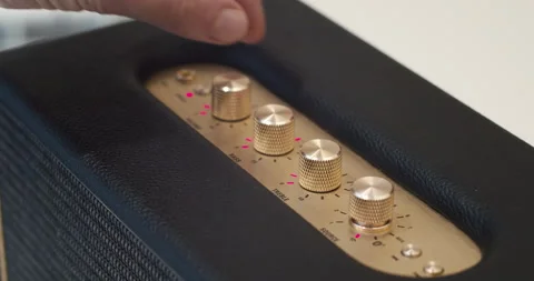 User adjusting the settings on wireless audio sound system with tone knobs Video stock 147229189